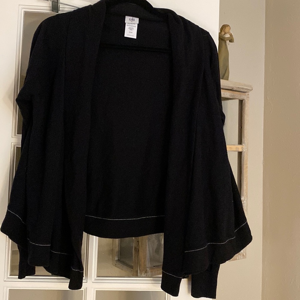 Cabi shrug jacket, black with white trim.